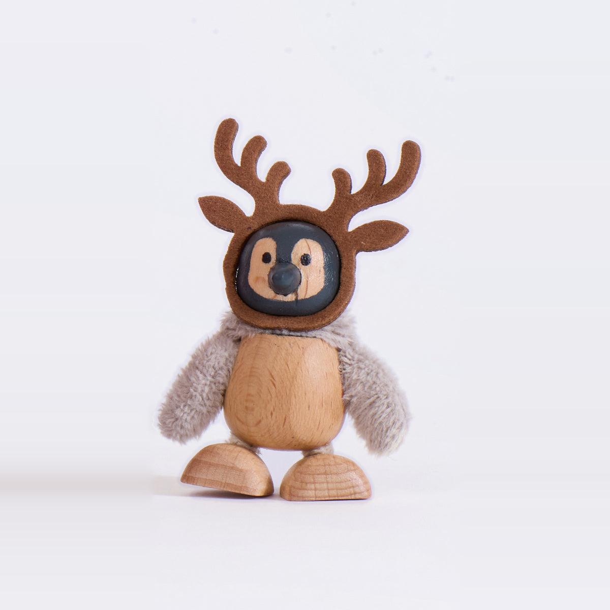 Close-up of the baby penguin wearing reindeer antlers from the Cheery Santa set