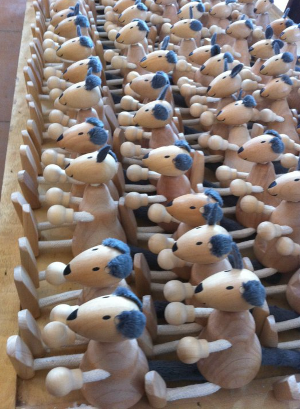 multiply rows of wooden kangaroo toys