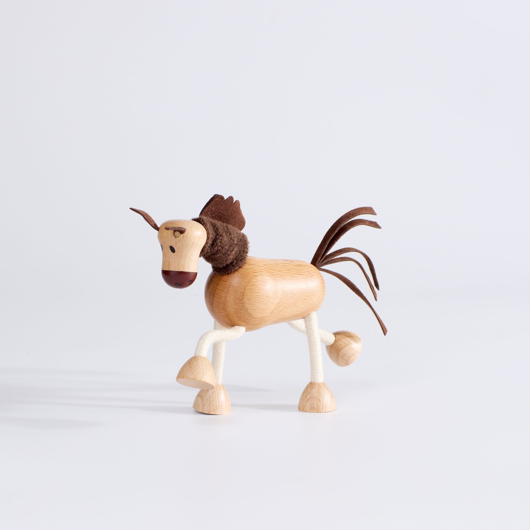 Side profile of Anamalz Wooden Horse – sensory toy with bendable rope legs for toddlers