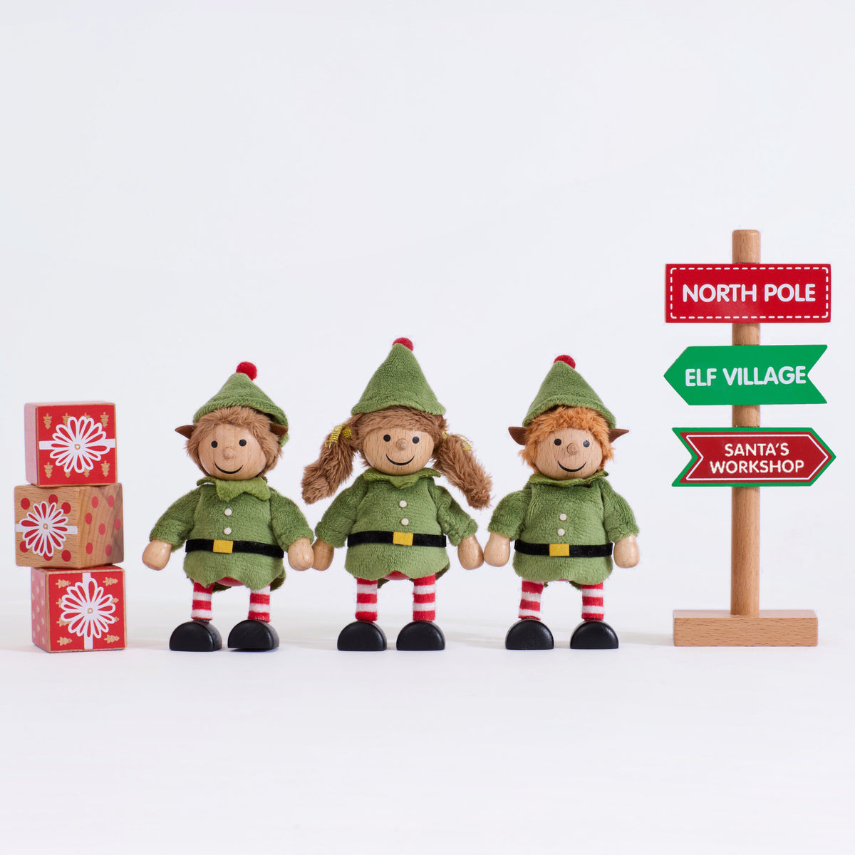 Complete Cheeky Elves set with three elves, three present blocks and corrected direction sign on a grey background
