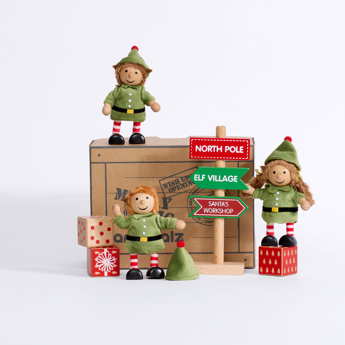 Cheeky Elves with their Merry Magic gift box, Christmas signpost and wooden presents