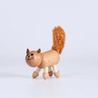 Wooden toy cat on a white background