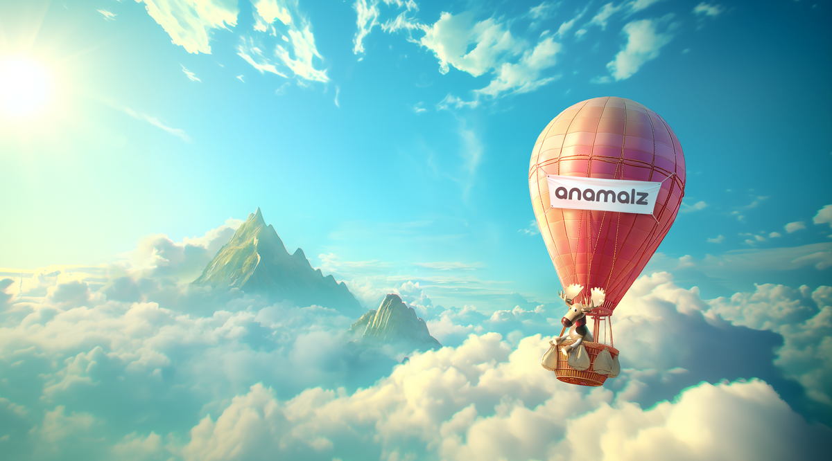 A pink and orange striped hot air balloon with the brand name 'anomalz' printed on the side, floating above a sea of clouds and distant mountains under a bright blue sky.
